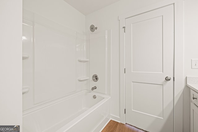 1313 Pj E Rd, Covington, GA 30014 - full bathroom with vanity, wood finished floors, and bathing tub / shower combination