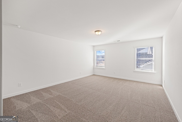 1313 Pj E Rd, Covington, GA 30014 - unfurnished room with light colored carpet