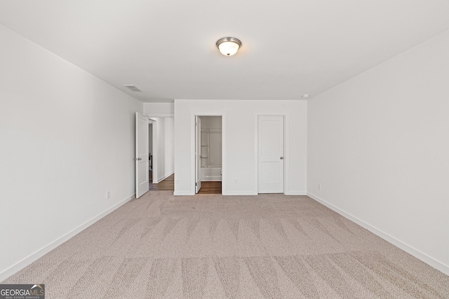 1313 Pj E Rd, Covington, GA 30014 - unfurnished bedroom featuring carpet and ensuite bath