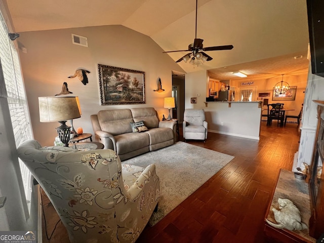120 Summer Trc, Thomaston, GA 30286 - living area with vaulted ceiling, dark wood-style flooring, ceiling fan, and a chandelier