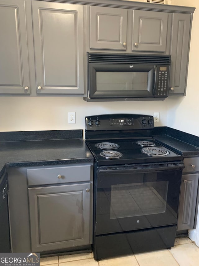 2367 Cascade Rd SW Unit B7, Atlanta, GA 30311 - kitchen with black appliances and gray cabinetry