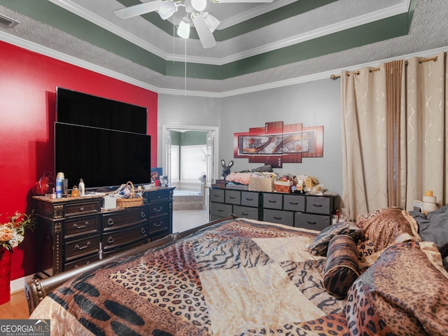 141 Wexford Ct, Stockbridge, GA 30281 - bedroom with crown molding, ceiling fan, wood finished floors, and a tray ceiling