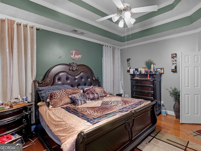 141 Wexford Ct, Stockbridge, GA 30281 - bedroom featuring wood finished floors, crown molding, a raised ceiling, and ceiling fan