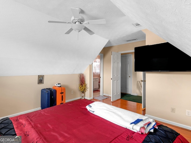 141 Wexford Ct, Stockbridge, GA 30281 - bedroom featuring a textured ceiling, ceiling fan, and vaulted ceiling