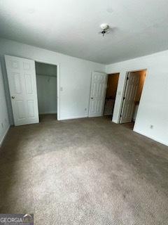 3609 Ginnis Rd SW Unit 6, Atlanta, GA 30331 - unfurnished bedroom with two closets