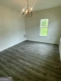 3609 Ginnis Rd SW Unit 6, Atlanta, GA 30331 - unfurnished dining area featuring a chandelier and dark wood-style floors