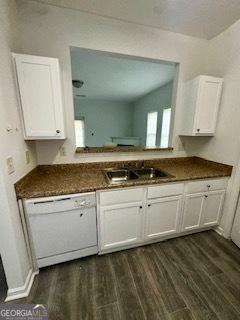 3609 Ginnis Rd SW Unit 6, Atlanta, GA 30331 - kitchen with dishwasher, dark wood-style floors, dark countertops, and white cabinets