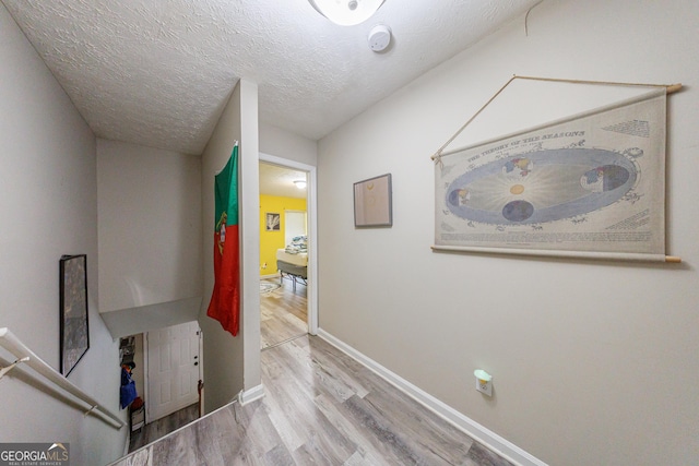 105 N River Dr Unit G, Sandy Springs, GA 30350 - hallway featuring wood finished floors and a textured ceiling
