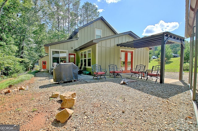 460 Morgan Mill Rd, Brooks, GA 30205 - rear view of house featuring board and batten siding, french doors, and a patio