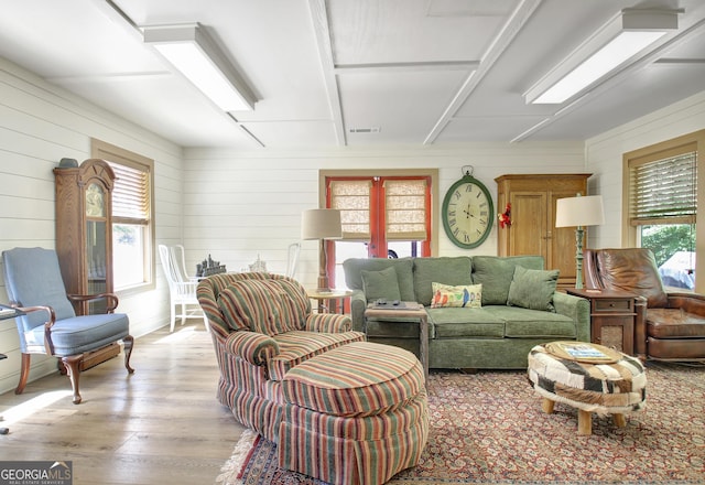 460 Morgan Mill Rd, Brooks, GA 30205 - living room featuring light wood-style flooring and wooden walls