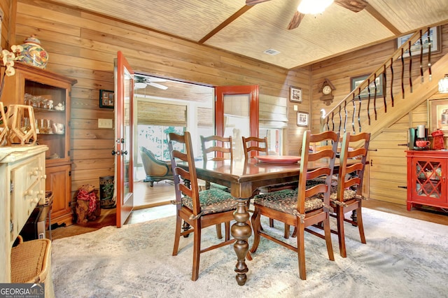 460 Morgan Mill Rd, Brooks, GA 30205 - dining space featuring a ceiling fan, wooden walls, and stairway