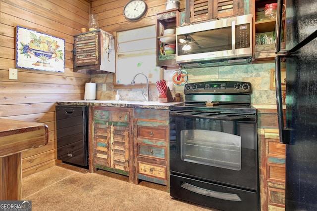 460 Morgan Mill Rd, Brooks, GA 30205 - kitchen with black appliances, wood walls, wine cooler, and a ceiling fan