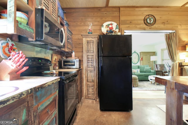 460 Morgan Mill Rd, Brooks, GA 30205 - kitchen with black appliances and wood walls