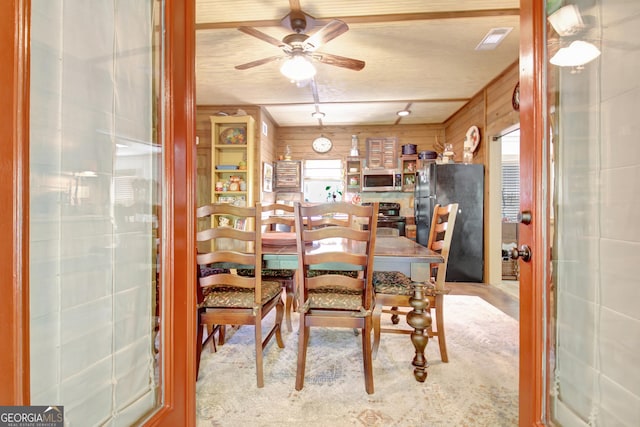 460 Morgan Mill Rd, Brooks, GA 30205 - dining area featuring wooden walls and a ceiling fan
