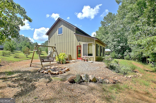 460 Morgan Mill Rd, Brooks, GA 30205 - back of house featuring board and batten siding and a patio area