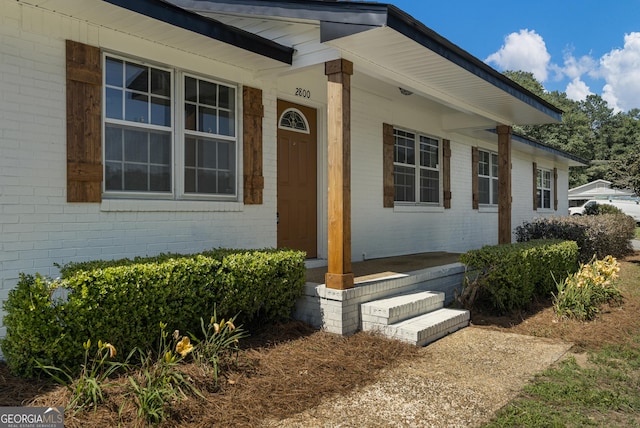 2800 Vultee Dr, Columbus, GA 31909 - doorway to property featuring covered porch and brick siding