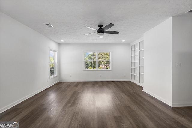 2800 Vultee Dr, Columbus, GA 31909 - empty room featuring dark wood finished floors, a textured ceiling, ceiling fan, built in shelves, and recessed lighting