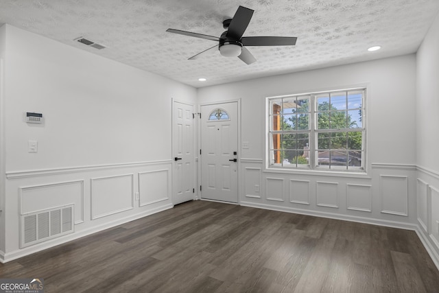 2800 Vultee Dr, Columbus, GA 31909 - foyer entrance with dark wood-style flooring, a textured ceiling, wainscoting, a ceiling fan, and recessed lighting