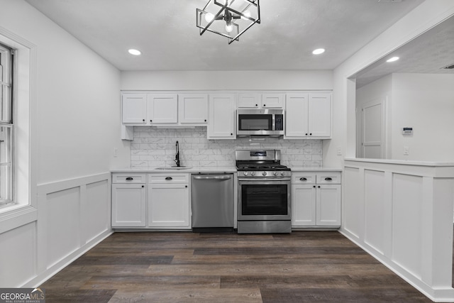 2800 Vultee Dr, Columbus, GA 31909 - kitchen featuring appliances with stainless steel finishes, light countertops, white cabinetry, recessed lighting, and decorative backsplash