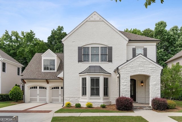 10580 Grandview Sq, Johns Creek, GA 30097 - view of front facade with stone siding, driveway, roof with shingles, and a garage