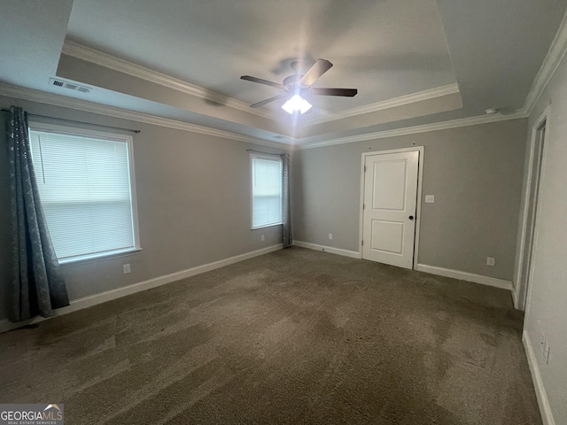 113 Sourwood Ln, Warner Robins, GA 31093 - carpeted empty room featuring a raised ceiling, ornamental molding, and a ceiling fan
