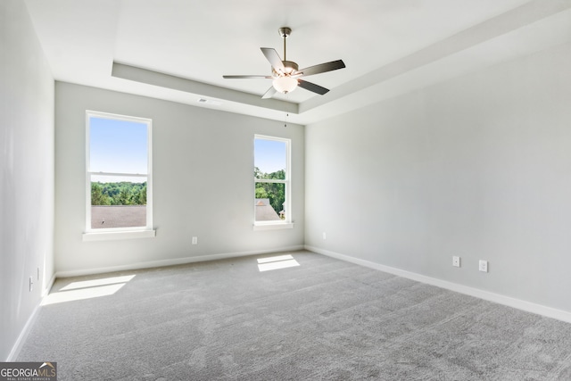 4601 Blacksmith Ln, Jefferson, GA 30549 - spare room featuring a tray ceiling, carpet floors, and ceiling fan