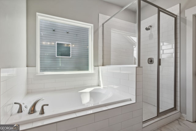 4601 Blacksmith Ln, Jefferson, GA 30549 - full bath featuring a bath, a shower stall, and marble look tiles