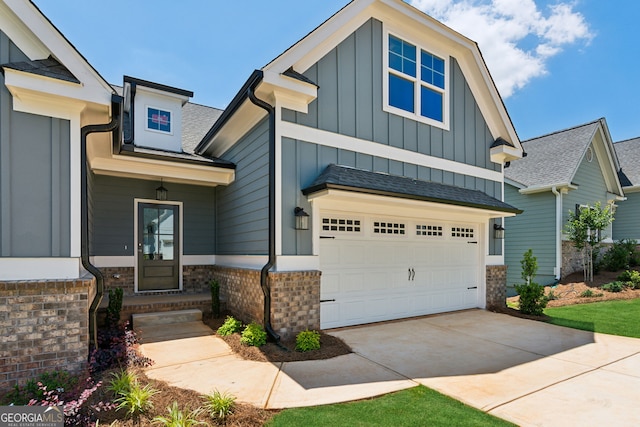 4601 Blacksmith Ln, Jefferson, GA 30549 - craftsman house featuring board and batten siding, concrete driveway, an attached garage, stone siding, and a shingled roof