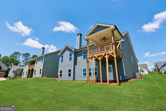 4601 Blacksmith Ln, Jefferson, GA 30549 - rear view of house with a ceiling fan, a chimney, a lawn, and a wooden deck