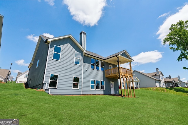 4601 Blacksmith Ln, Jefferson, GA 30549 - back of house with a ceiling fan, a yard, a chimney, and a deck