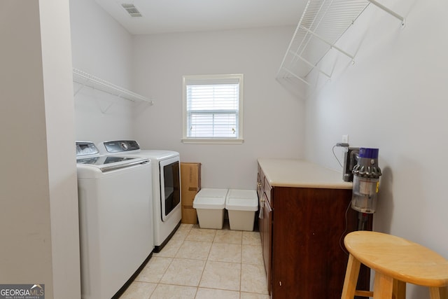 2940 Bentbill Xing, Cumming, GA 30041 - laundry area with washer and clothes dryer and light tile patterned floors