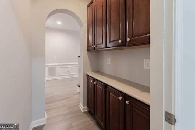 2940 Bentbill Xing, Cumming, GA 30041 - bar area with arched walkways, light wood-style flooring, wainscoting, and recessed lighting