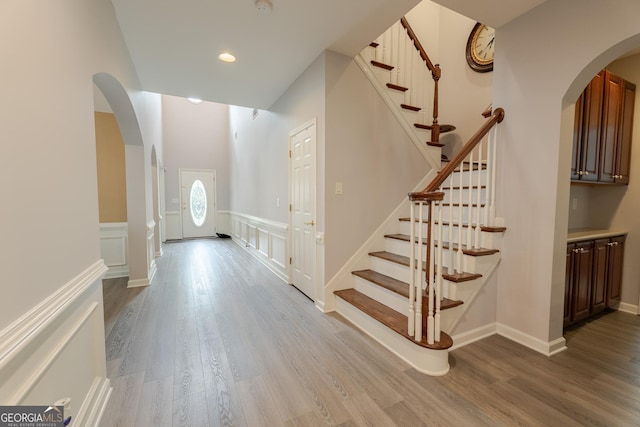 2940 Bentbill Xing, Cumming, GA 30041 - entrance foyer with arched walkways, wood finished floors, stairway, and recessed lighting