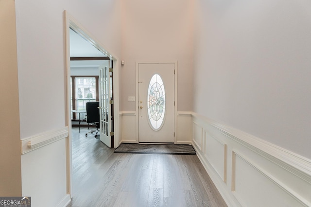2940 Bentbill Xing, Cumming, GA 30041 - entryway featuring wood finished floors, wainscoting, and a decorative wall