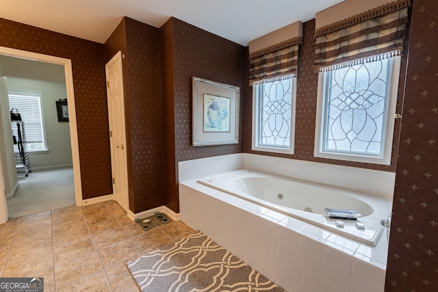 2940 Bentbill Xing, Cumming, GA 30041 - bathroom featuring wallpapered walls, a whirlpool tub, healthy amount of natural light, and tile patterned flooring