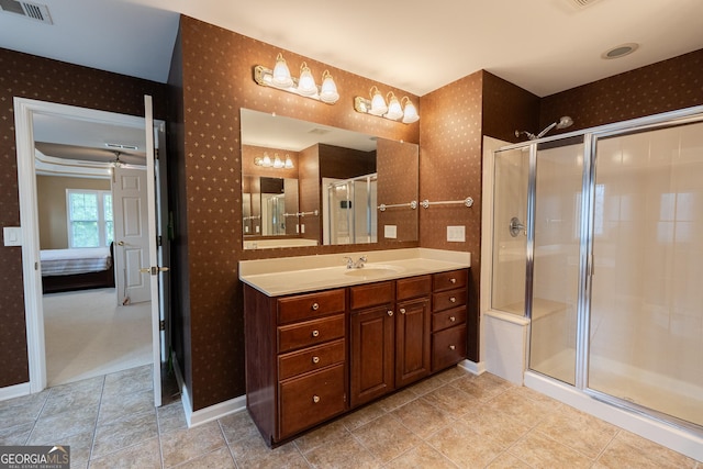 2940 Bentbill Xing, Cumming, GA 30041 - bathroom featuring wallpapered walls, vanity, a shower stall, and ceiling fan