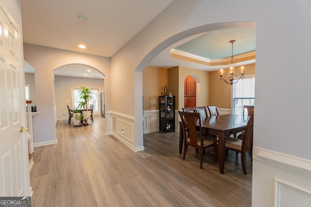 2940 Bentbill Xing, Cumming, GA 30041 - dining area featuring light wood-type flooring, healthy amount of natural light, arched walkways, a chandelier, and recessed lighting