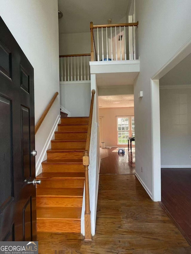 2994 Abbotts Oak Way, Duluth, GA 30097 - stairs featuring wood finished floors and baseboards