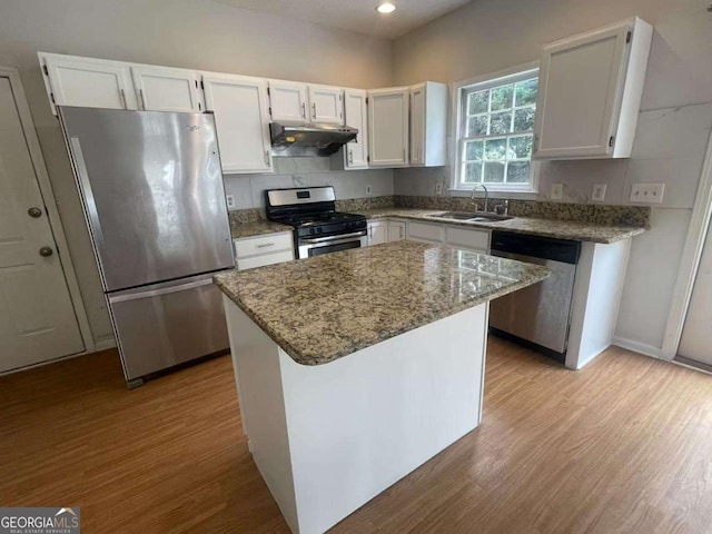 2994 Abbotts Oak Way, Duluth, GA 30097 - kitchen featuring stainless steel appliances, under cabinet range hood, wood finished floors, white cabinets, and recessed lighting