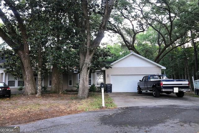 251 Indian Bay Dr, Freeport, FL 32439 - view of front of home with a garage and driveway