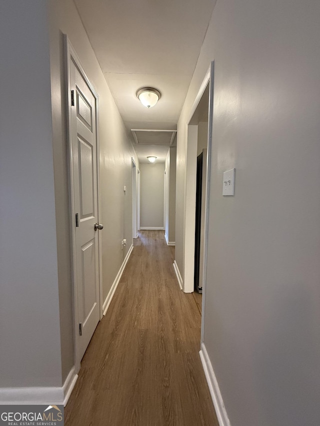 882 Campbell Rd, Covington, GA 30014 - hallway with dark wood-style floors and baseboards