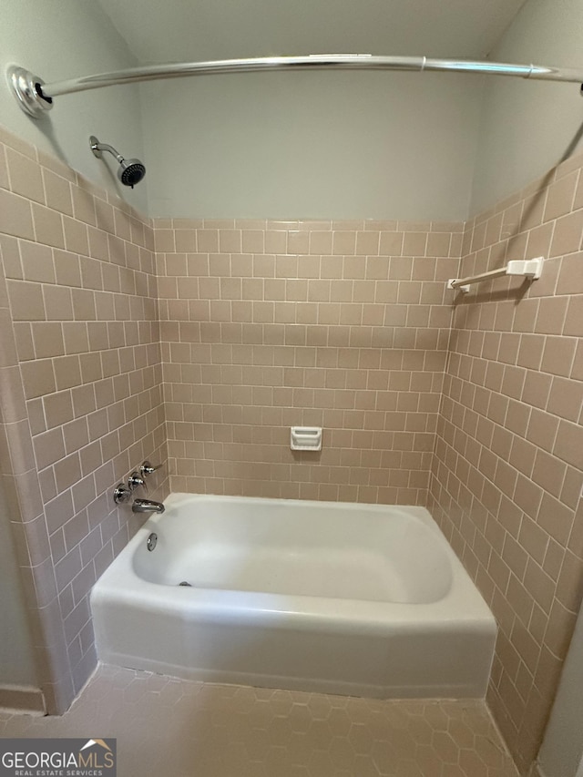 882 Campbell Rd, Covington, GA 30014 - bathroom featuring shower / washtub combination and tile patterned flooring