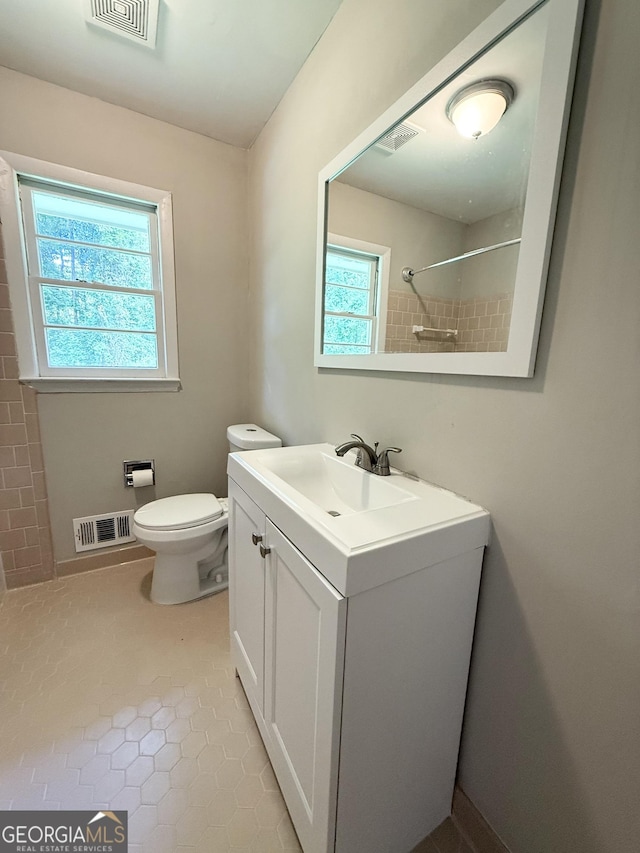 882 Campbell Rd, Covington, GA 30014 - full bath with plenty of natural light, a shower, vanity, and tile patterned floors