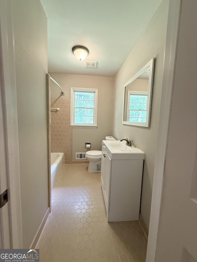 882 Campbell Rd, Covington, GA 30014 - bathroom featuring vanity, bathing tub / shower combination, and tile patterned floors