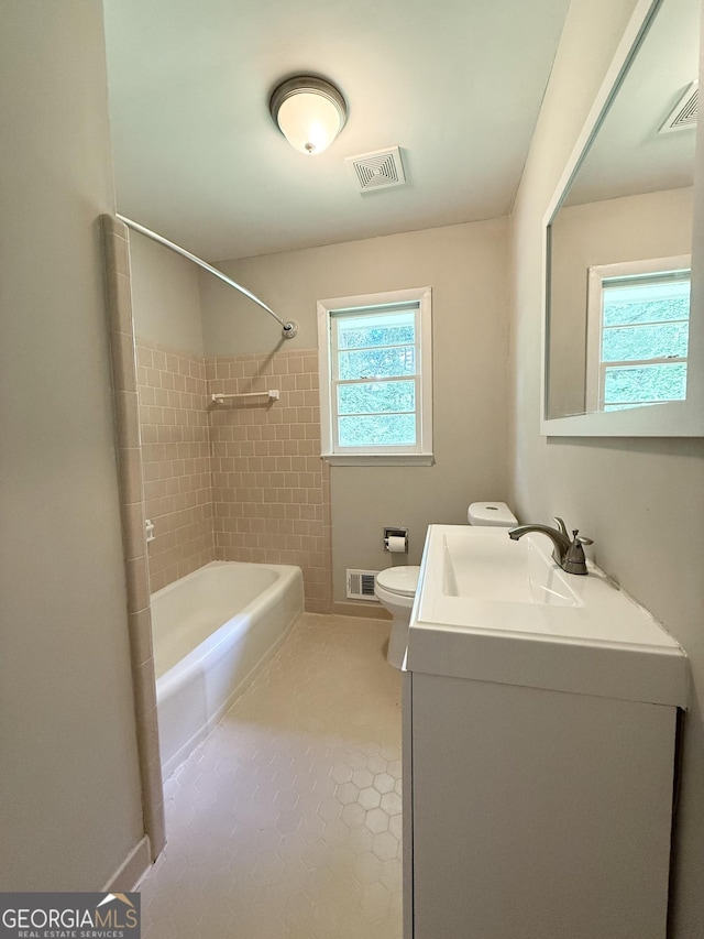 882 Campbell Rd, Covington, GA 30014 - bathroom with vanity, bathtub / shower combination, and tile patterned floors