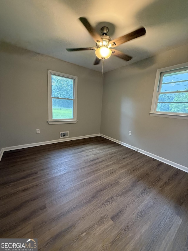 882 Campbell Rd, Covington, GA 30014 - unfurnished room with a ceiling fan and dark wood-style flooring
