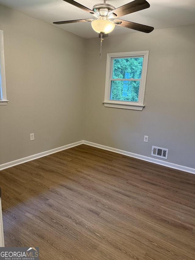 882 Campbell Rd, Covington, GA 30014 - spare room with ceiling fan and dark wood finished floors
