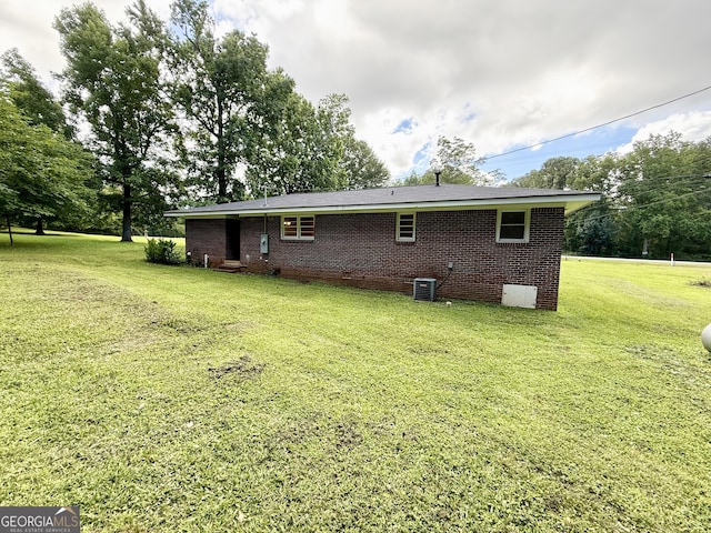 882 Campbell Rd, Covington, GA 30014 - rear view of property featuring crawl space, a yard, and brick siding