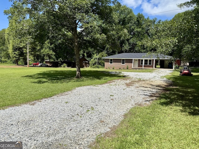 882 Campbell Rd, Covington, GA 30014 - ranch-style home featuring gravel driveway and a front yard