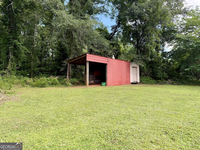 882 Campbell Rd, Covington, GA 30014 - view of green lawn featuring an outbuilding and a pole building